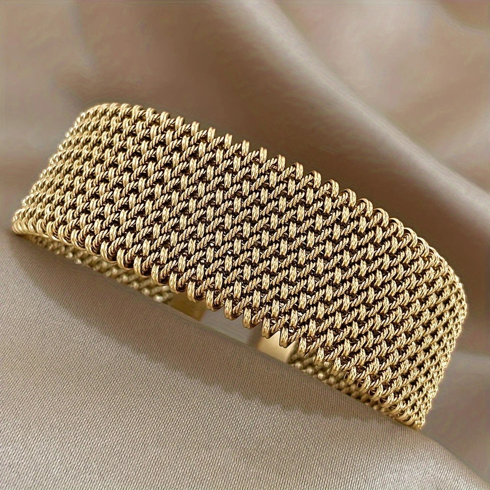 Golden cuff bracelet with mesh chain