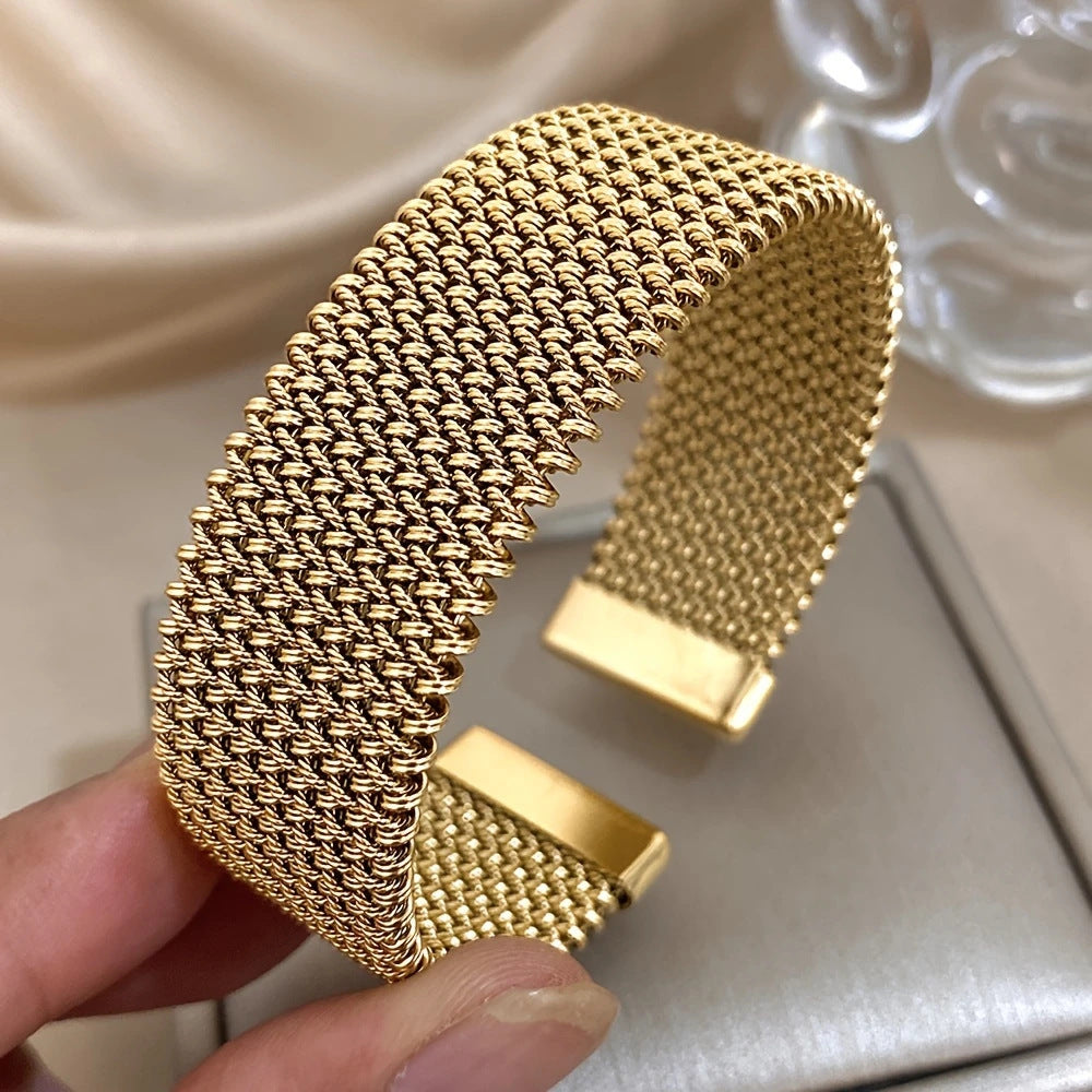 Golden cuff bracelet with mesh chain