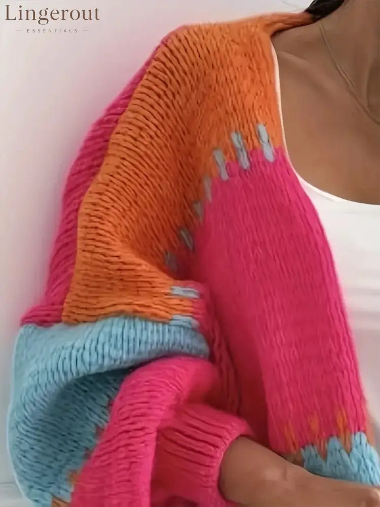 Candy Cloud Cardigan – oversized color block knit in orange, pink, blue, and contrasting tones.