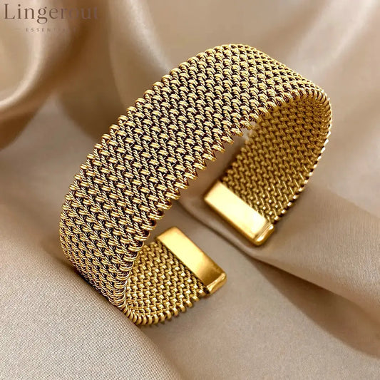 Golden cuff bracelet with mesh chain